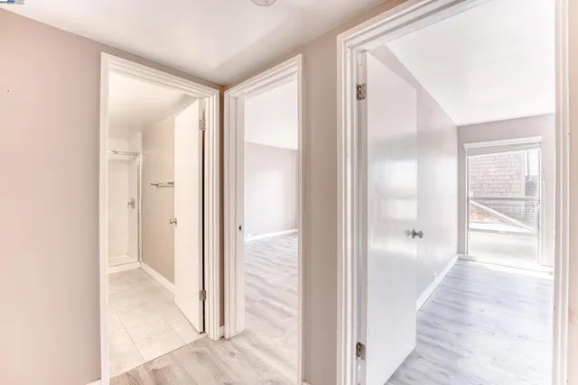 a view of a bathroom from a hallway