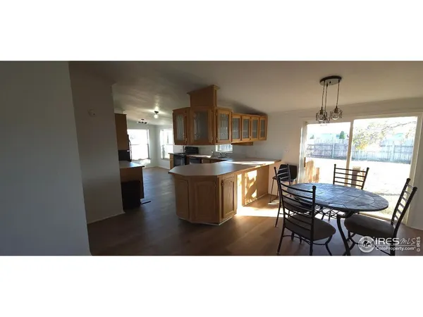 a open kitchen with dining table and chairs