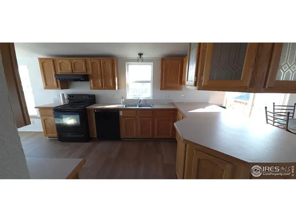 a kitchen with a wooden floor