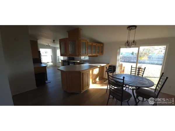 a open kitchen with dining table and chairs