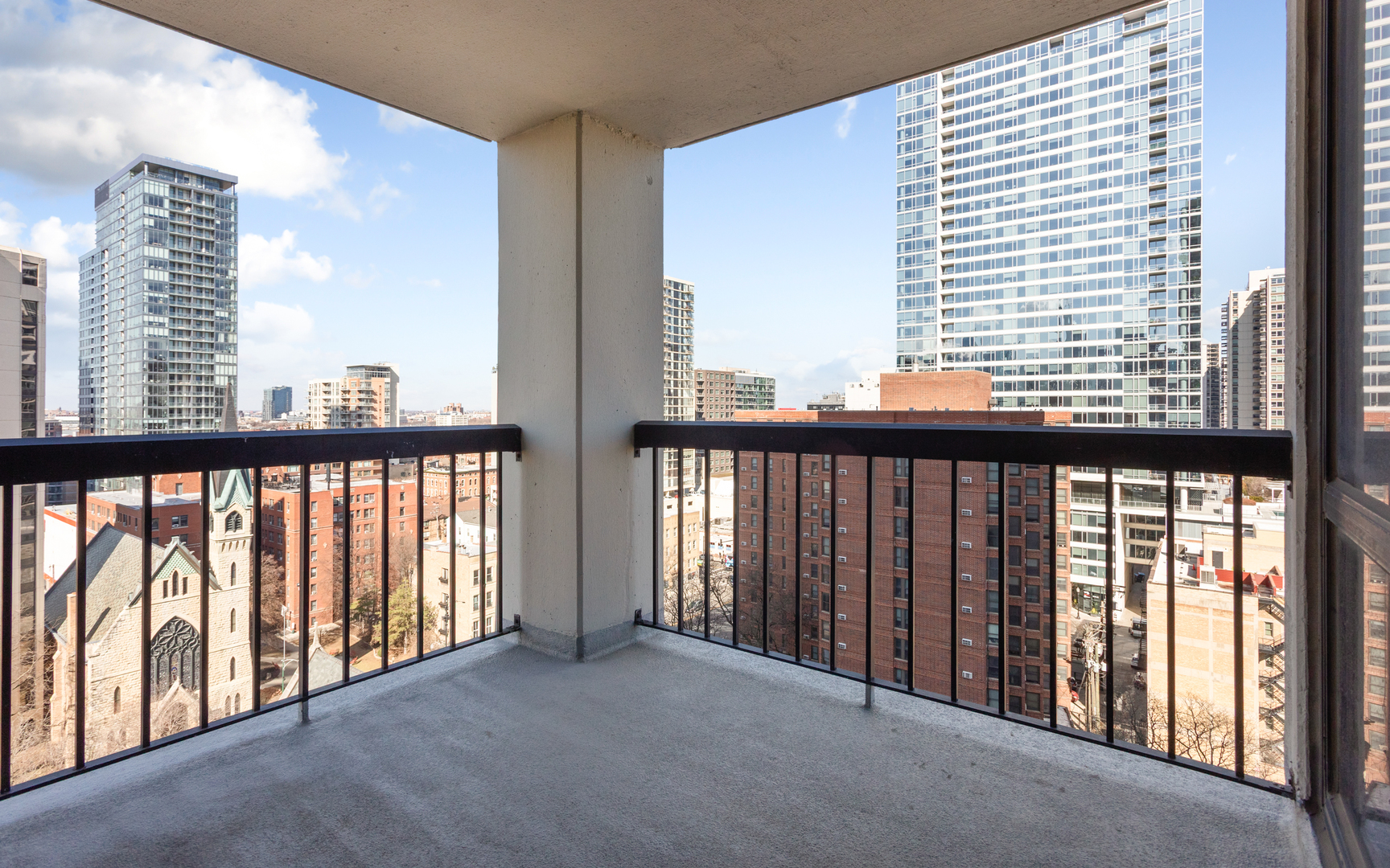 1122 North Clark Street, Unit 1203 Chicago, IL 60610 - Photo 14 of 22 a view of a city from a balcony