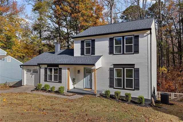 a front view of a house with a yard