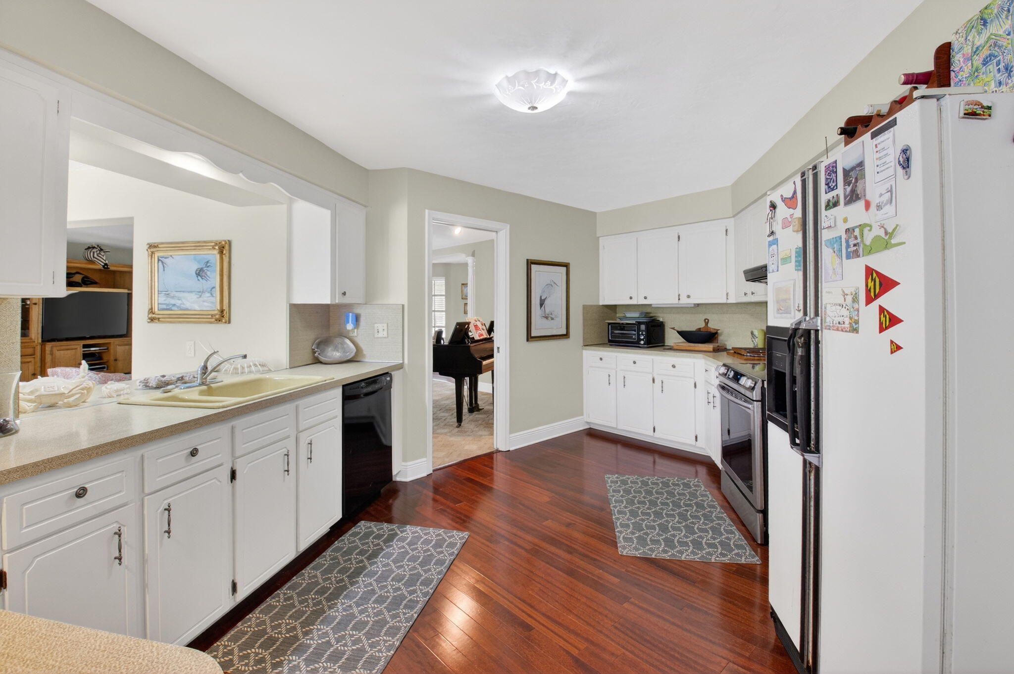 30 Spanish River Drive Ocean Ridge, FL 33435 - Photo 29 of 68 a kitchen with stainless steel appliances granite countertop a refrigerator sink and white cabinets