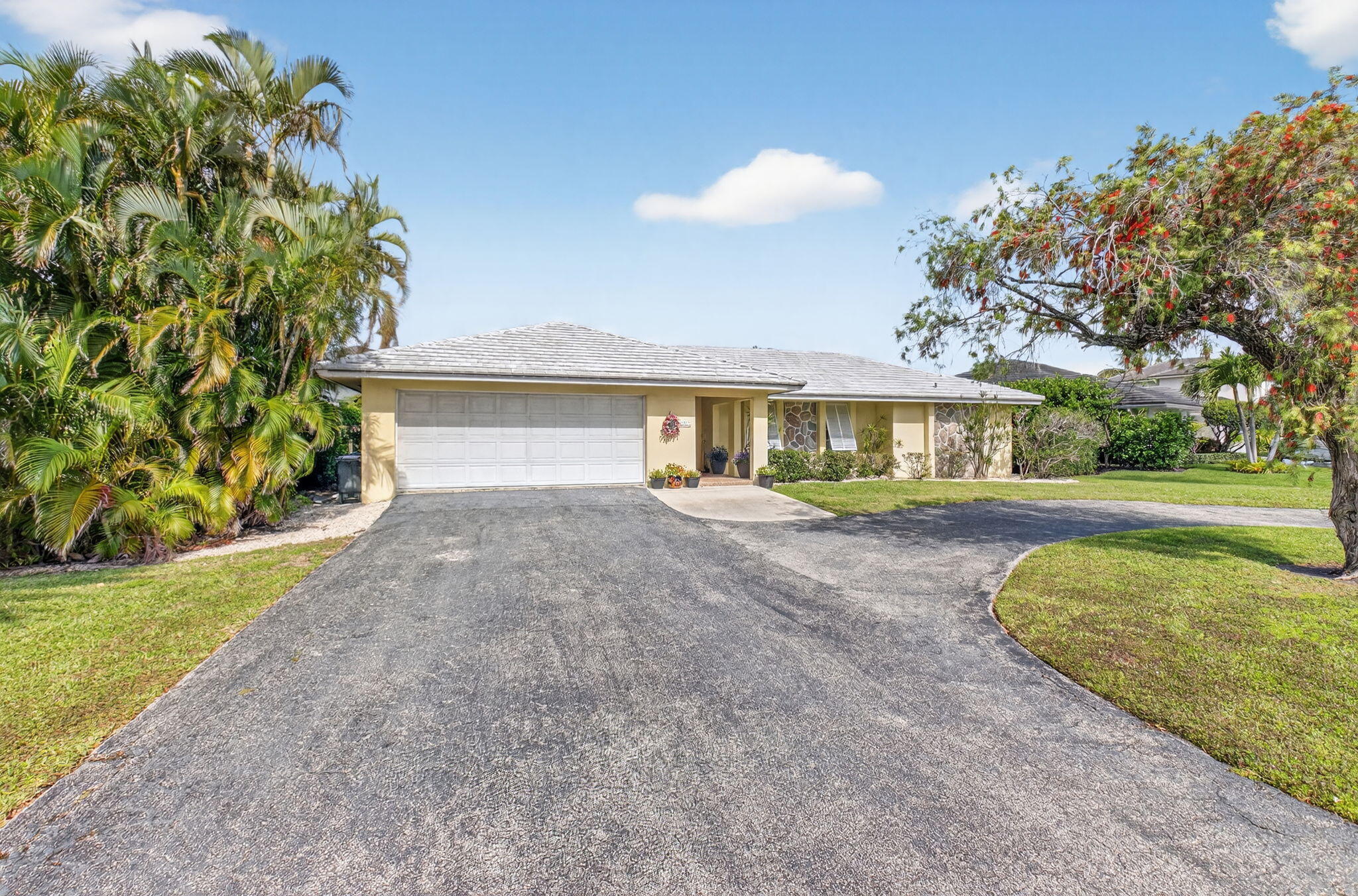 30 Spanish River Drive Ocean Ridge, FL 33435 - Photo 32 of 68 a front view of a house with garden