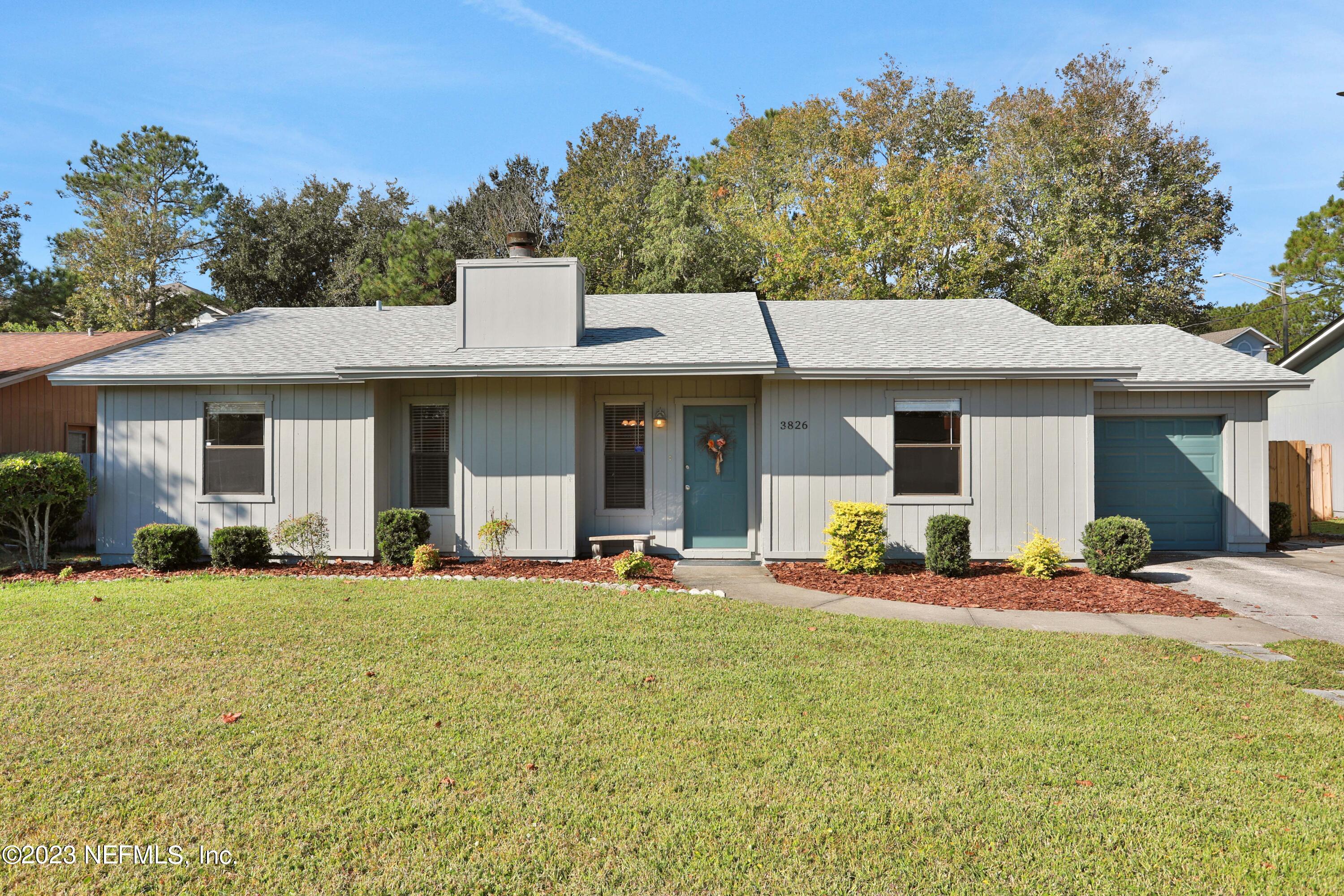 3826 Eunice Road Jacksonville, FL 32250 - Photo 1 of 45 a front view of a house with a garden and porch