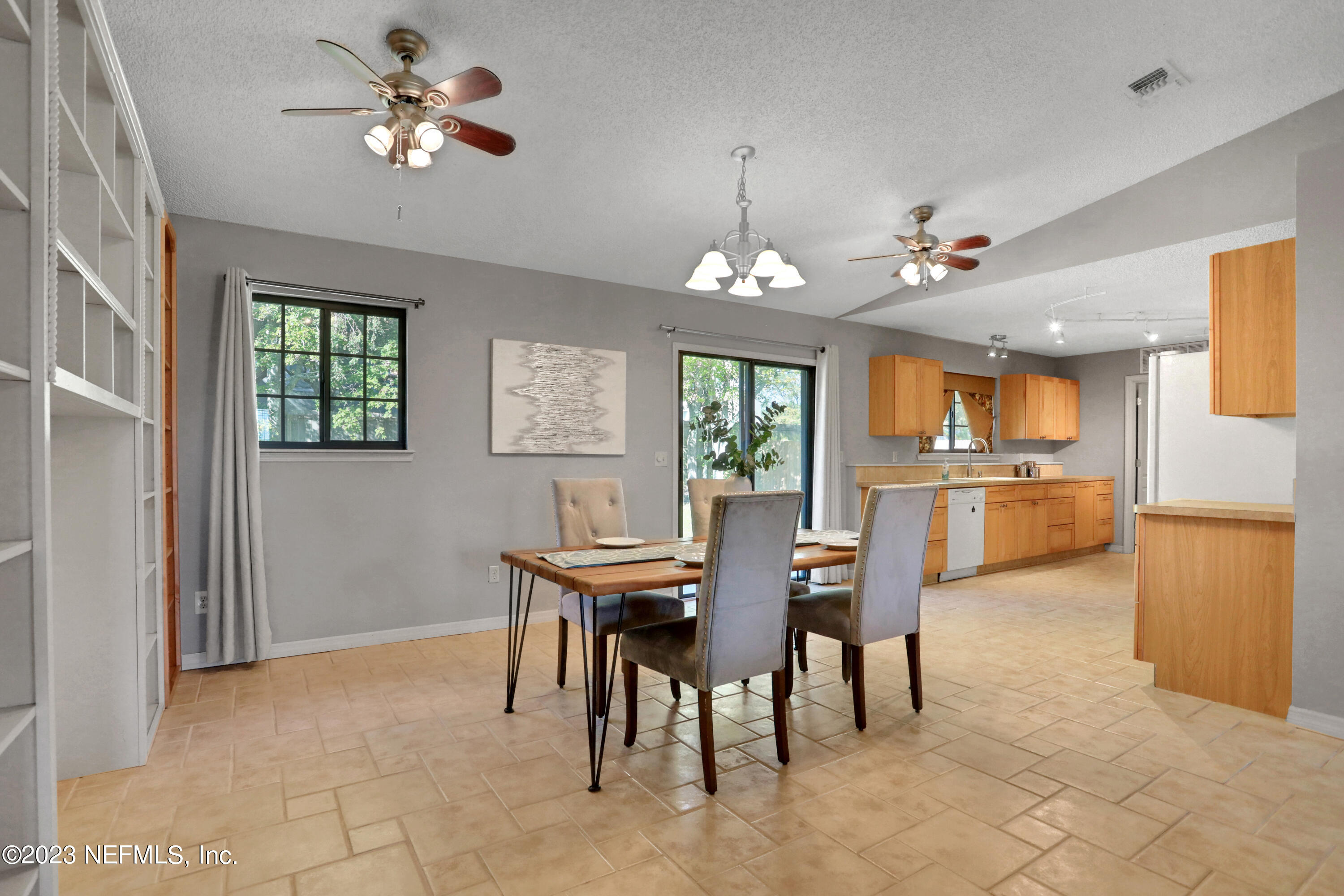 3826 Eunice Road Jacksonville, FL 32250 - Photo 24 of 45 a view of a dining room with furniture and chandelier