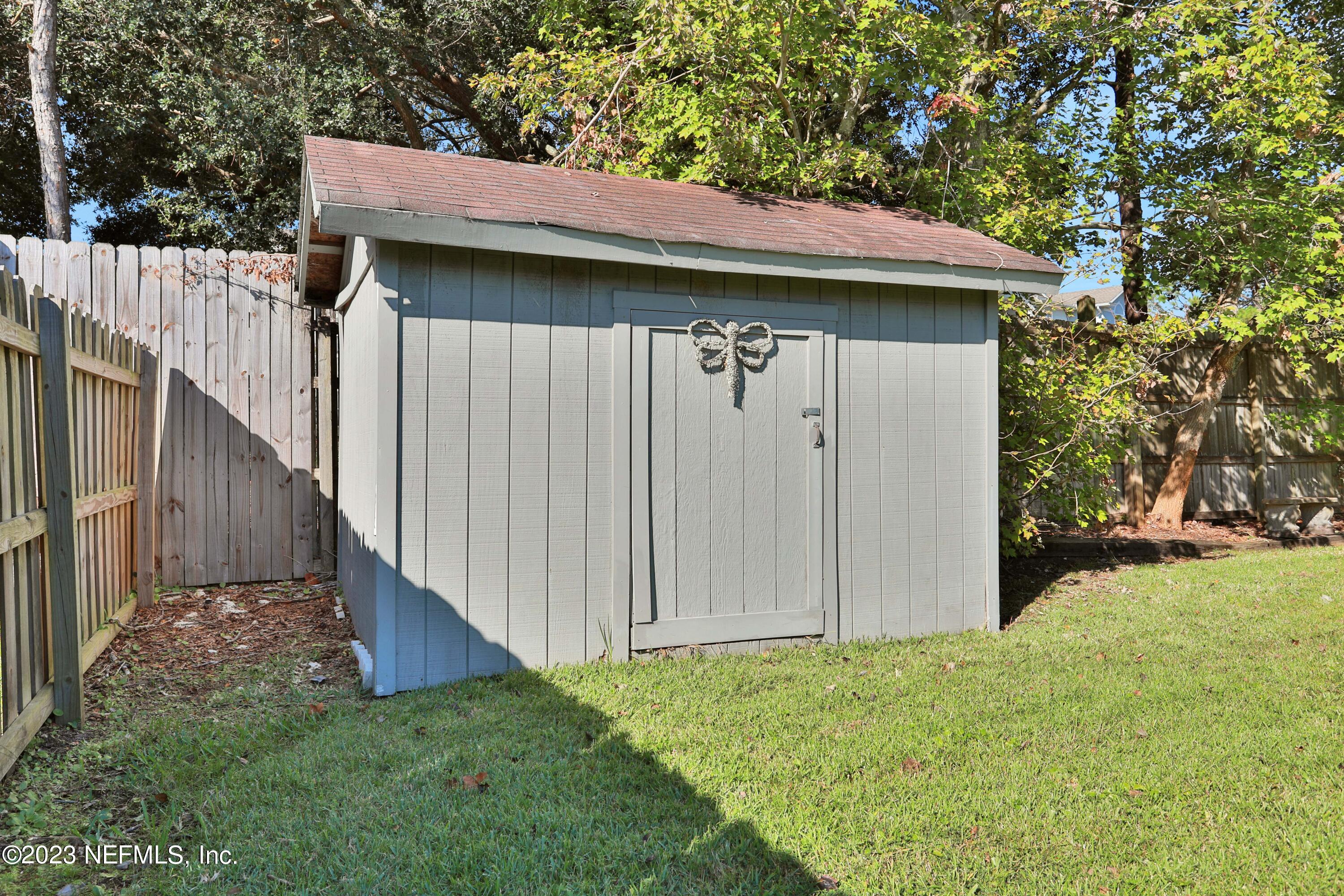 3826 Eunice Road Jacksonville, FL 32250 - Photo 32 of 45 a view of a house with wooden fence