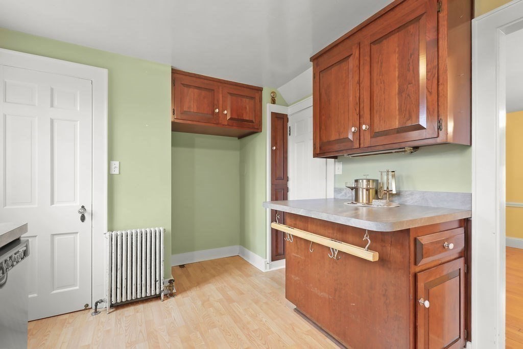 1297 Old Worcester Road Framingham, MA 01701 - Photo 17 of 41 a kitchen with stainless steel appliances granite countertop a sink stove and cabinets