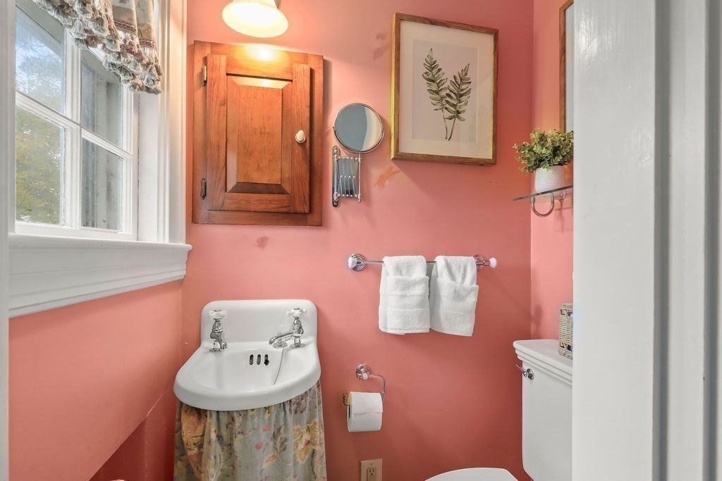 1297 Old Worcester Road Framingham, MA 01701 - Photo 19 of 41 a bathroom with a sink mirror and toilet
