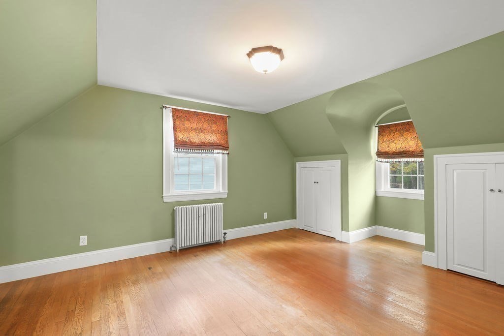 1297 Old Worcester Road Framingham, MA 01701 - Photo 29 of 41 an empty room with windows and closet