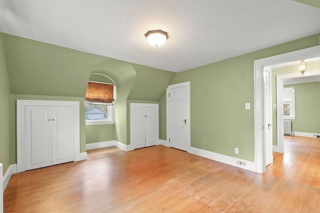 1297 Old Worcester Road Framingham, MA 01701 - Photo 30 of 41 a view of a livingroom with wooden floor and closet
