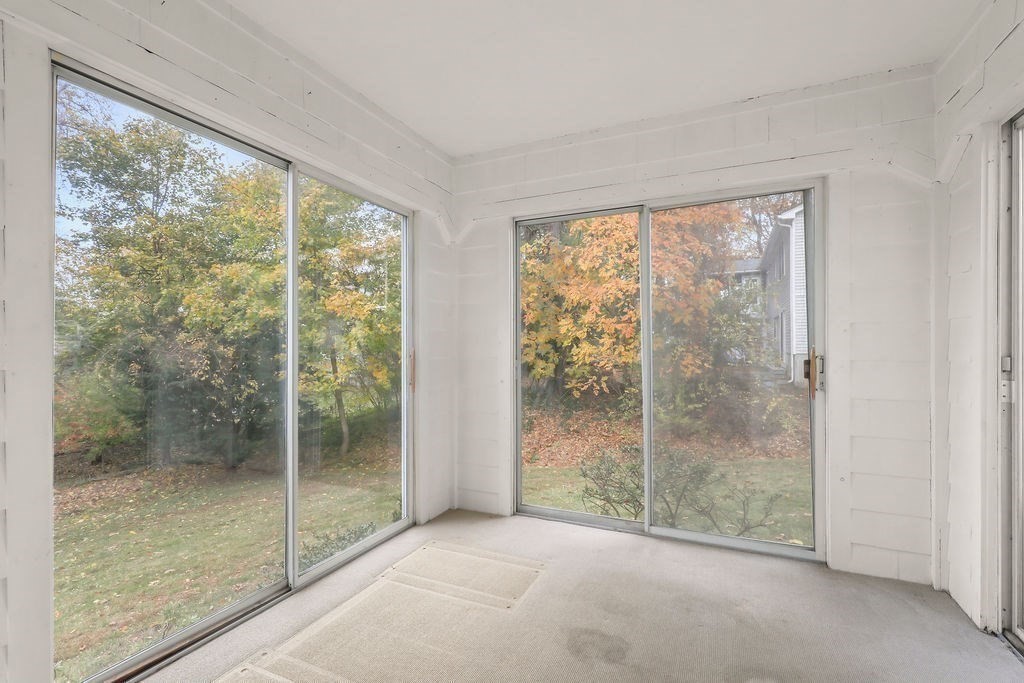 1297 Old Worcester Road Framingham, MA 01701 - Photo 31 of 41 a view of a room with sliding glass door