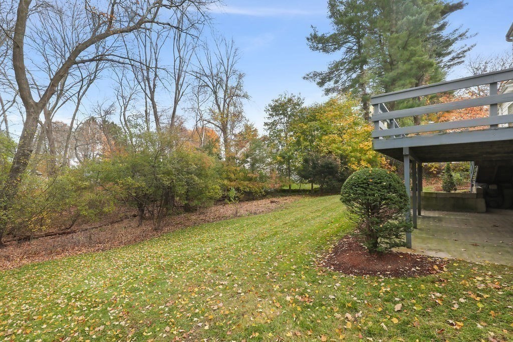 1297 Old Worcester Road Framingham, MA 01701 - Photo 36 of 41 a view of a house with a small yard and plants