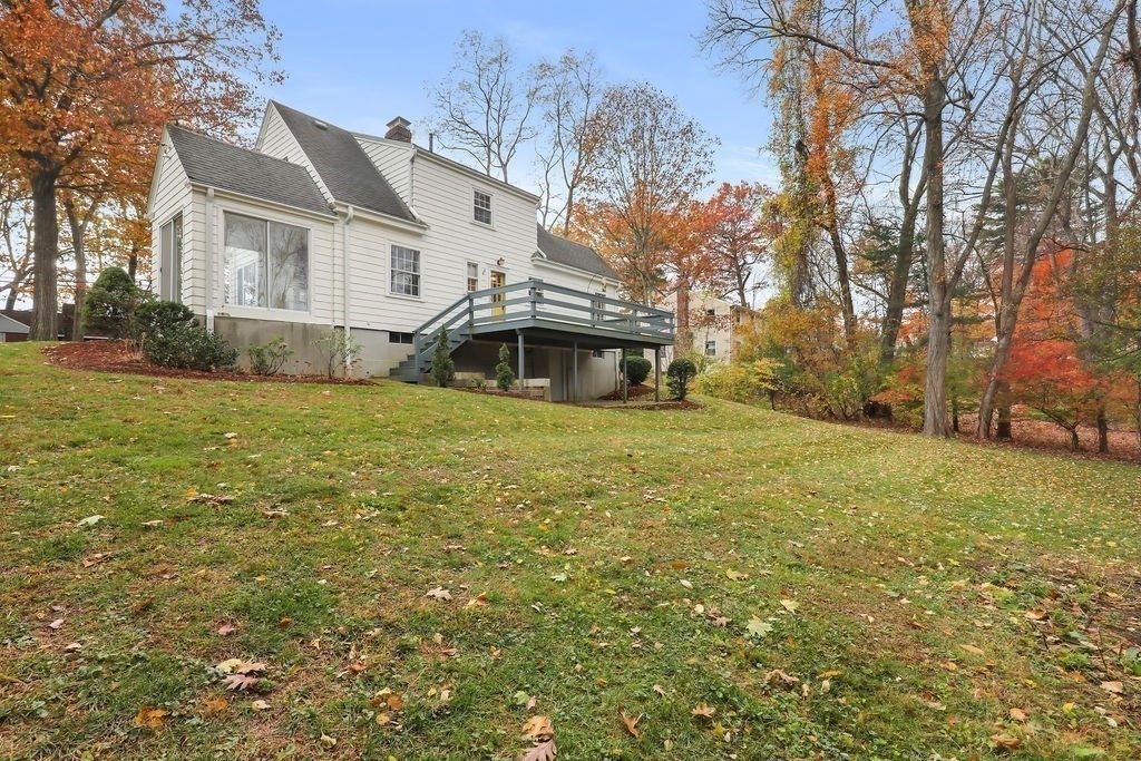 1297 Old Worcester Road Framingham, MA 01701 - Photo 37 of 41 a view of a house with a yard