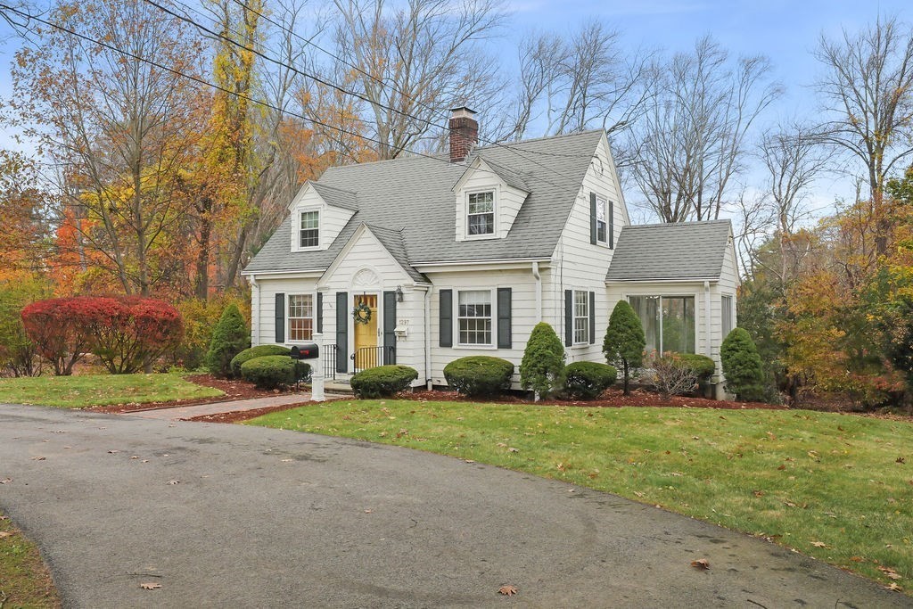 1297 Old Worcester Road Framingham, MA 01701 - Photo 4 of 41 a front view of a house with a yard