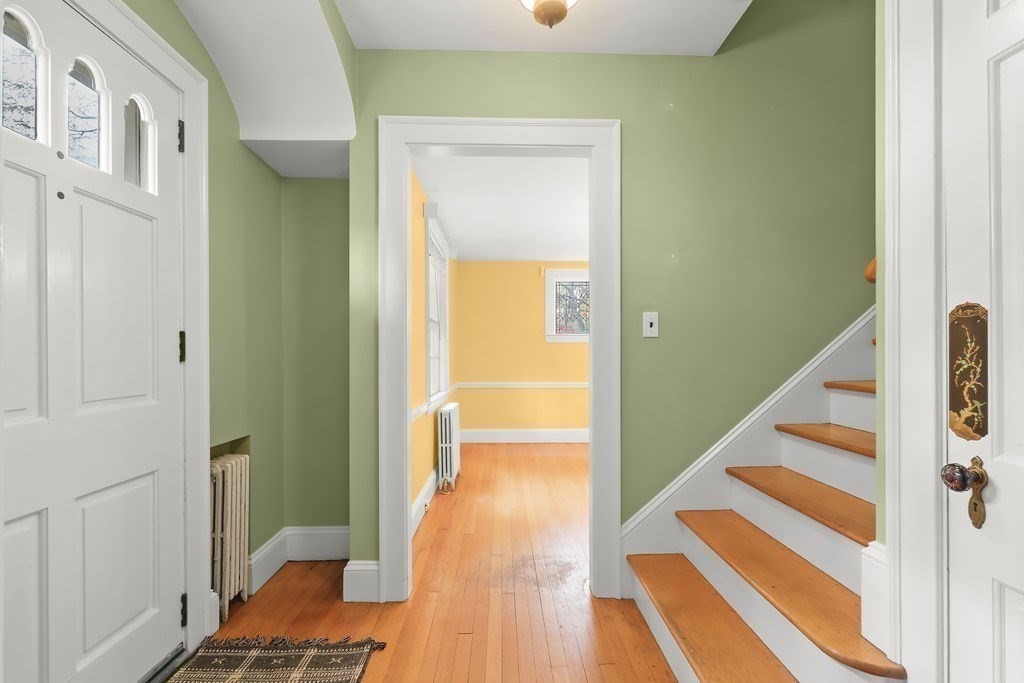 1297 Old Worcester Road Framingham, MA 01701 - Photo 5 of 41 a view of a hallway with wooden floor and staircase