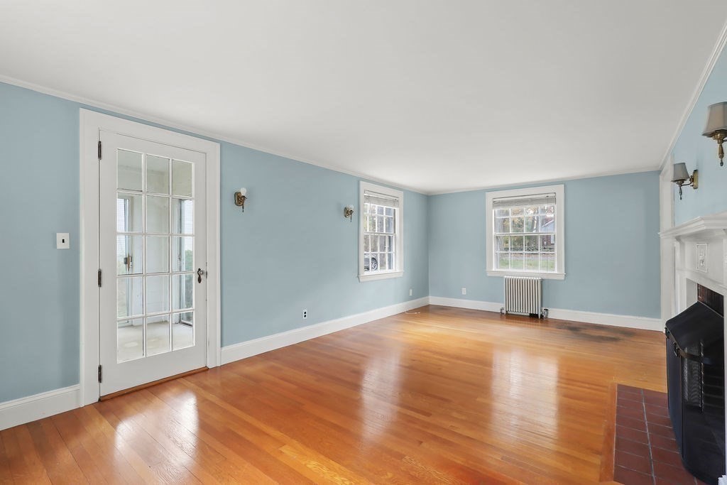 1297 Old Worcester Road Framingham, MA 01701 - Photo 9 of 41 a view of an empty room with a window and fireplace