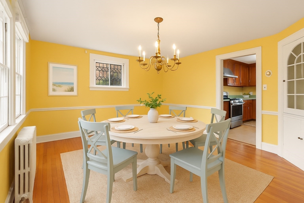 1297 Old Worcester Road Framingham, MA 01701 - Photo 10 of 41 a view of a dining room with furniture and wooden floor