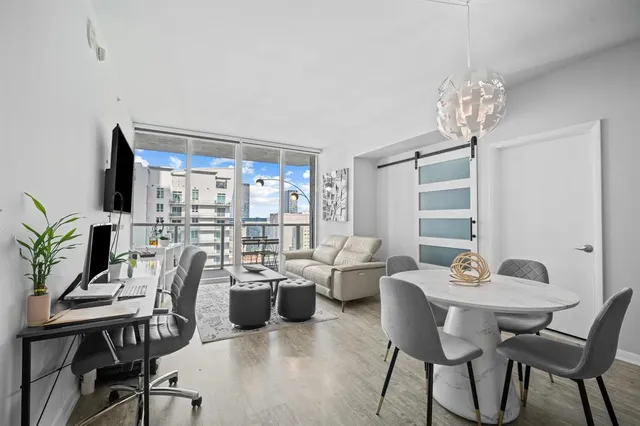 a view of a dining room with furniture window and outside view