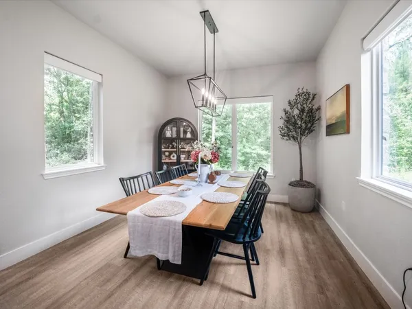 a bathroom with a white tub shower and vanity