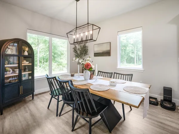 a bath tub sitting next to a bathroom sink