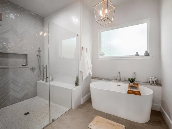 a bathroom with a granite countertop sink toilet and mirror