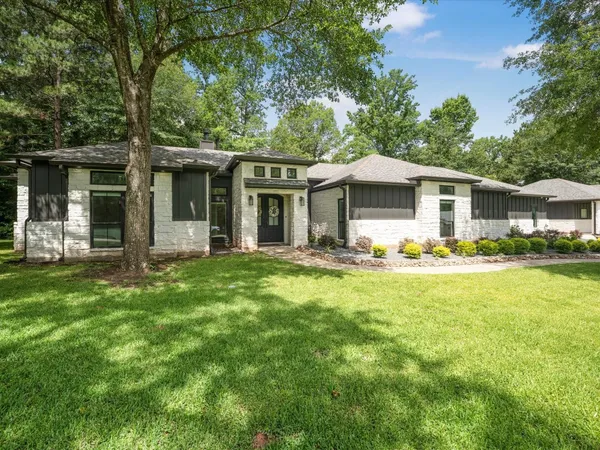 a view of a dining room with furniture a chandelier and wooden floor