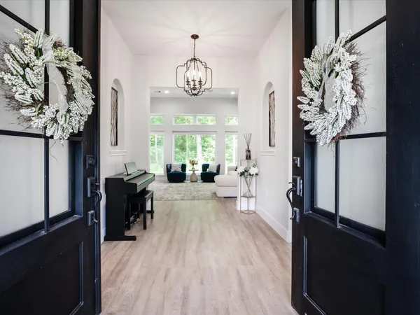 an entryway with a livingroom and a window