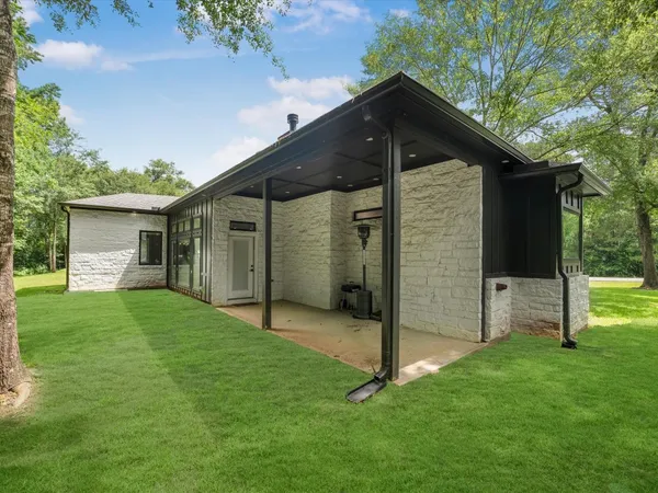 a front view of house with yard and green space