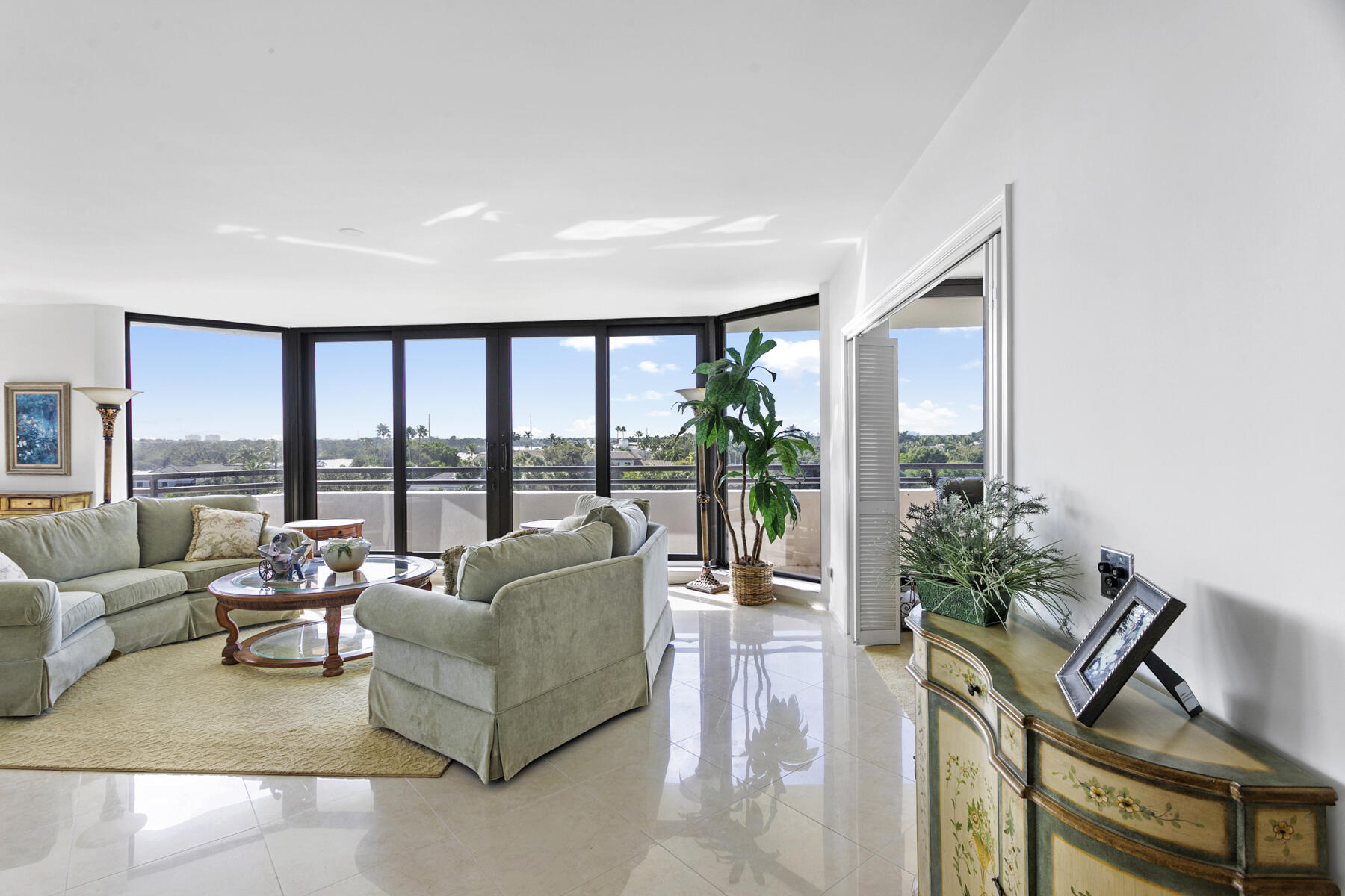 3322 Casseekey Island Road, Unit 504 Jupiter, FL 33477 - Photo 6 of 46 a living room with furniture and a large window
