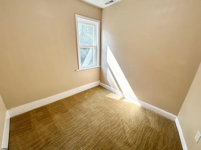 a view of an empty room and window