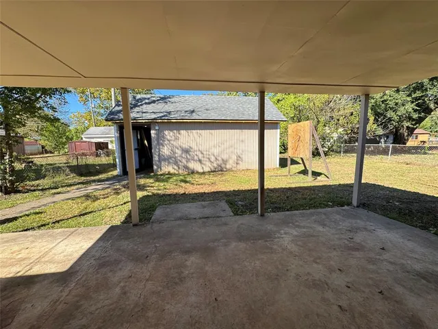 a view of a backyard of the house