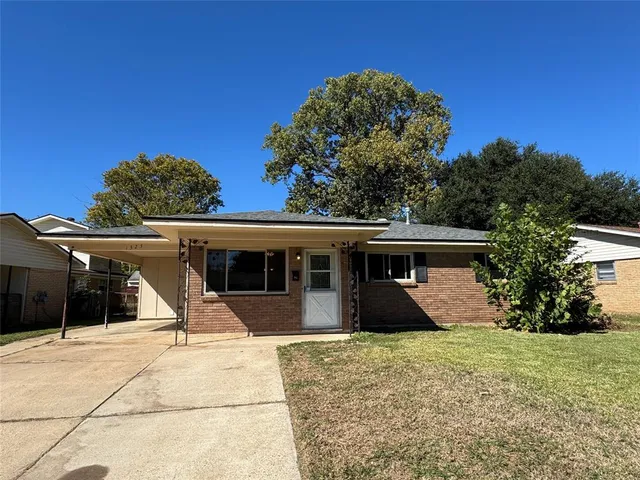 a kitchen with granite countertop stainless steel appliances and a sink