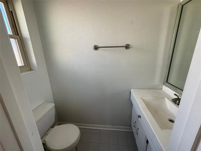 a view of an empty room with a large window