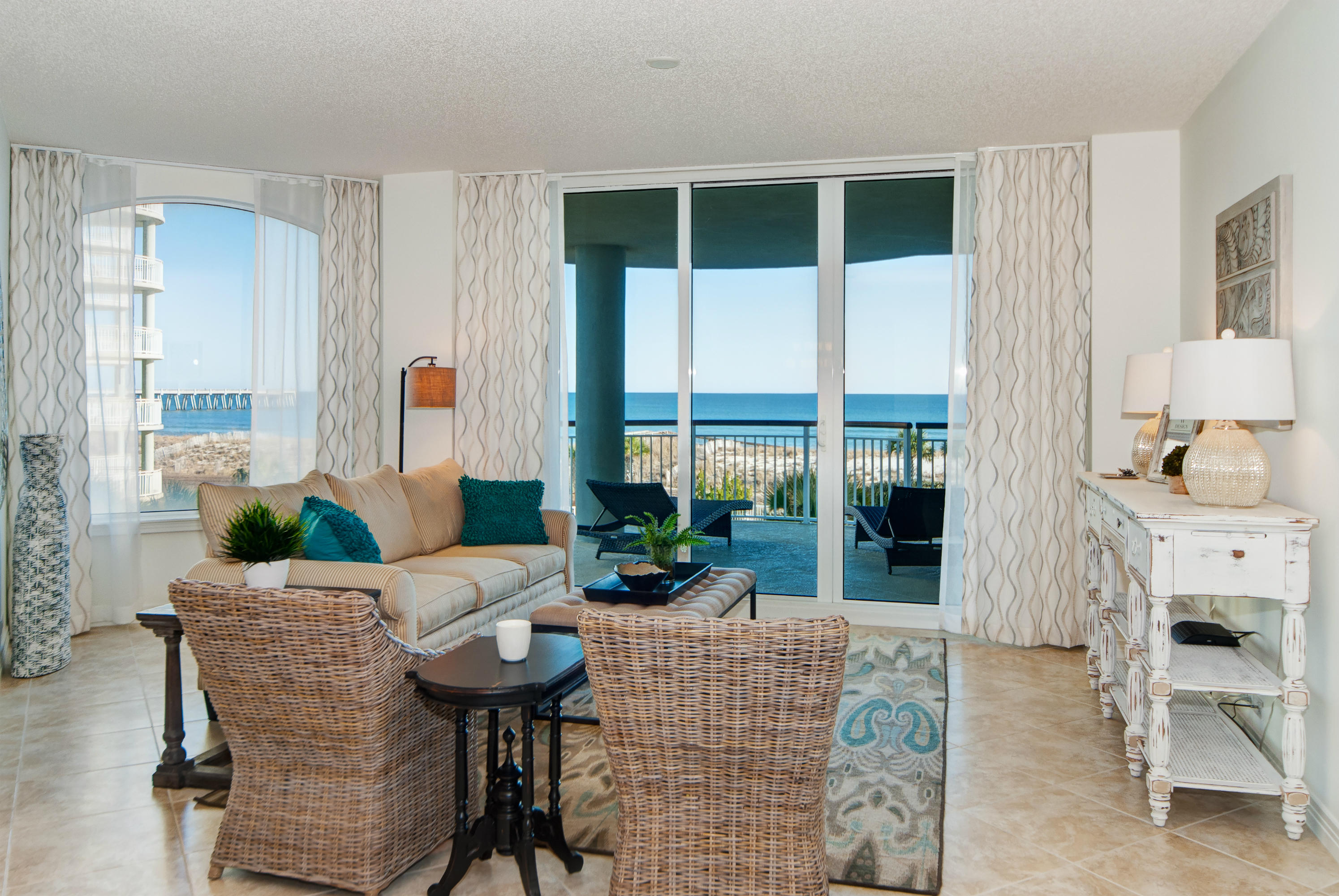 8501 Gulf Boulevard, Unit 1E Navarre, FL 32566 - Photo 2 of 12 a living room with furniture a fireplace and a table