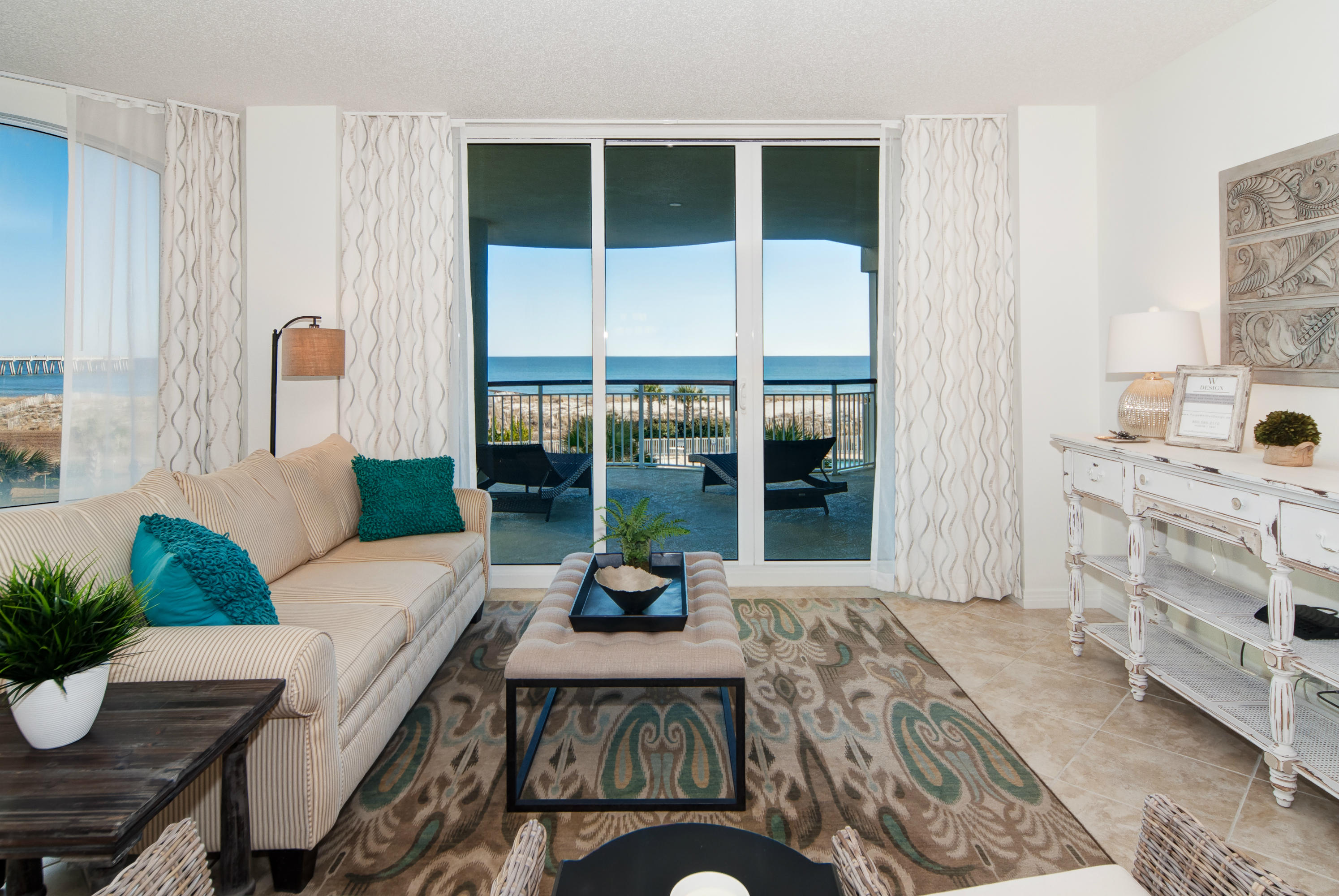 8501 Gulf Boulevard, Unit 1E Navarre, FL 32566 - Photo 3 of 12 a living room with furniture large windows and wooden floor