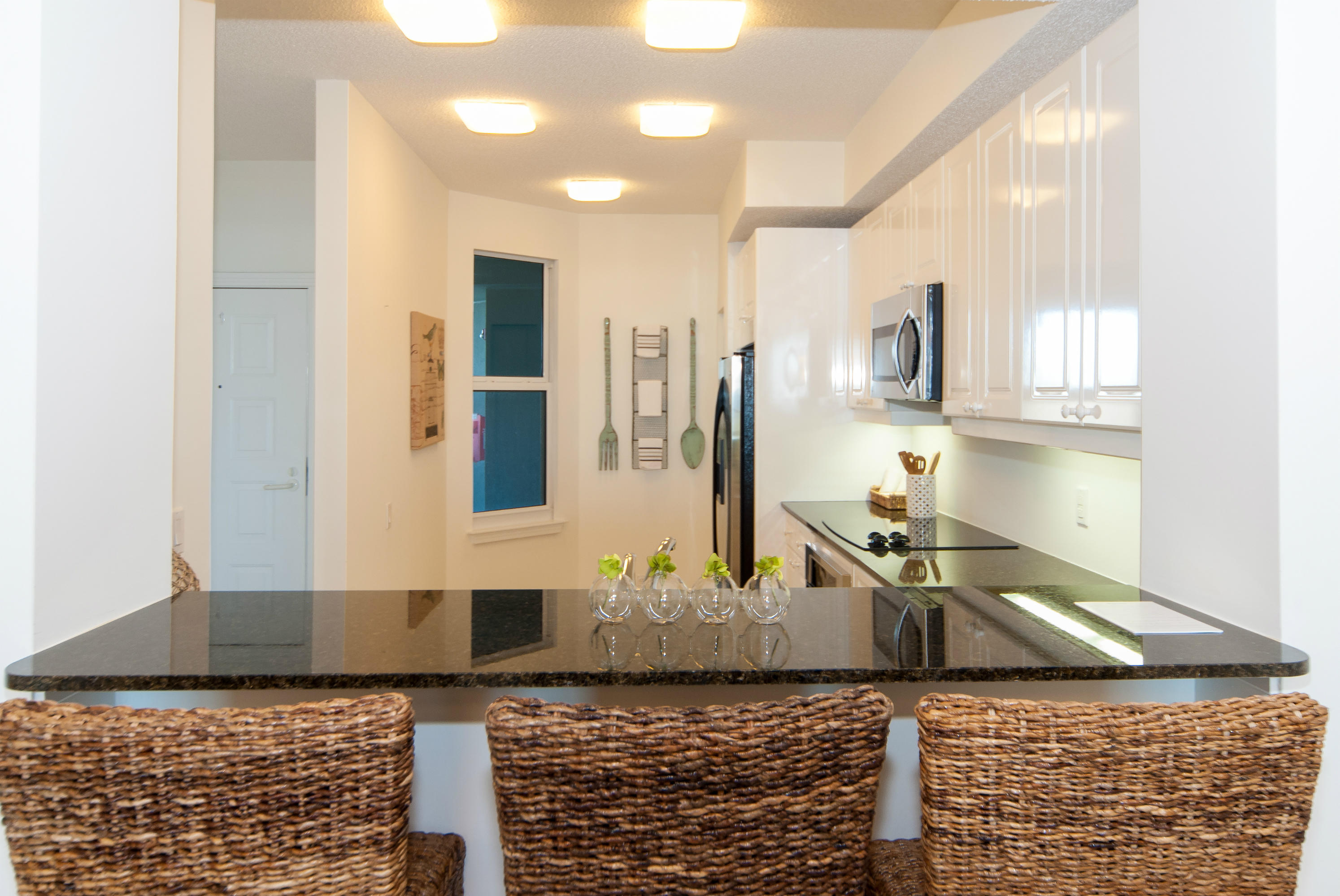 8501 Gulf Boulevard, Unit 1E Navarre, FL 32566 - Photo 5 of 12 a bathroom with a granite countertop sink and a mirror