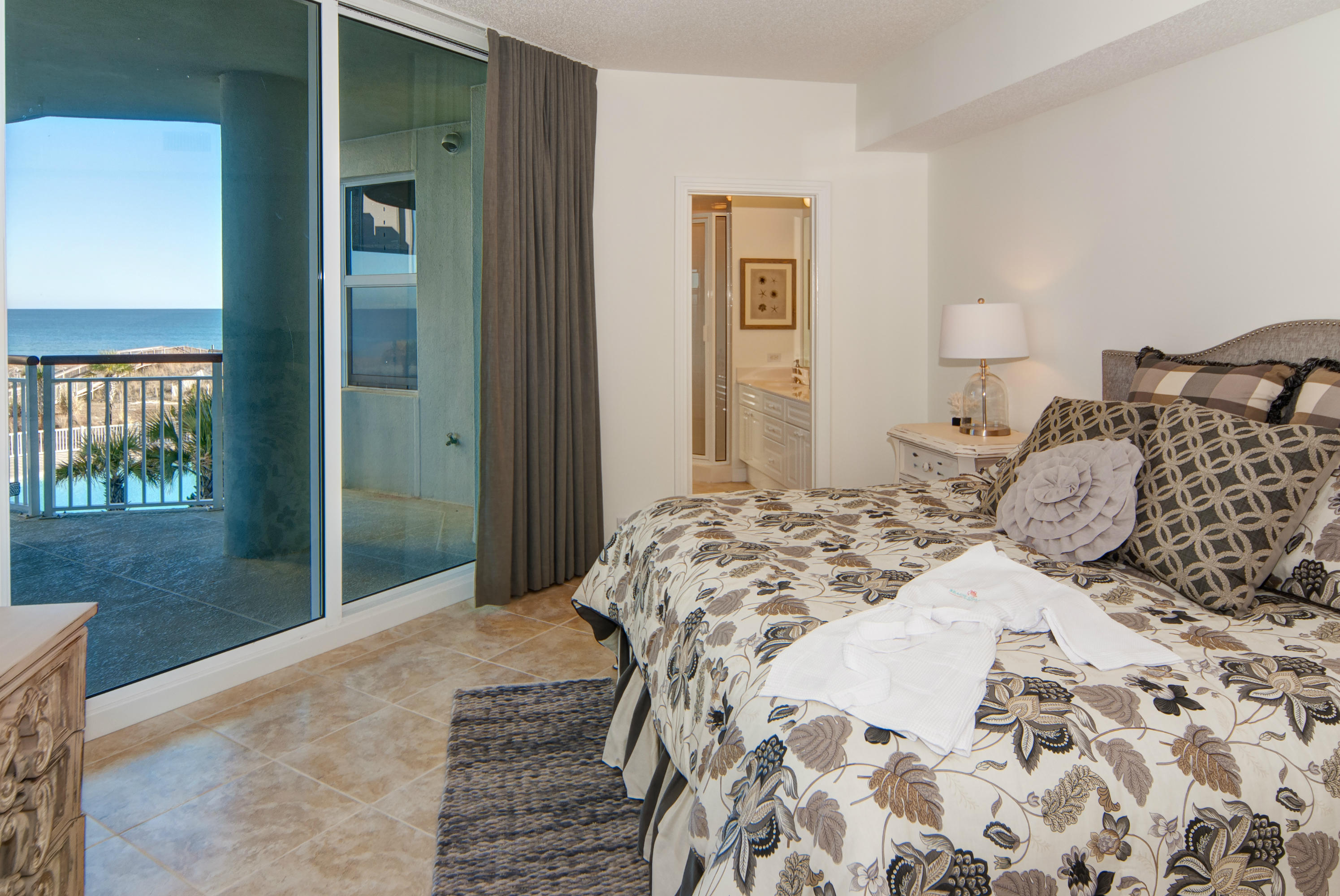 8501 Gulf Boulevard, Unit 1E Navarre, FL 32566 - Photo 7 of 12 a bedroom with a bed and a window