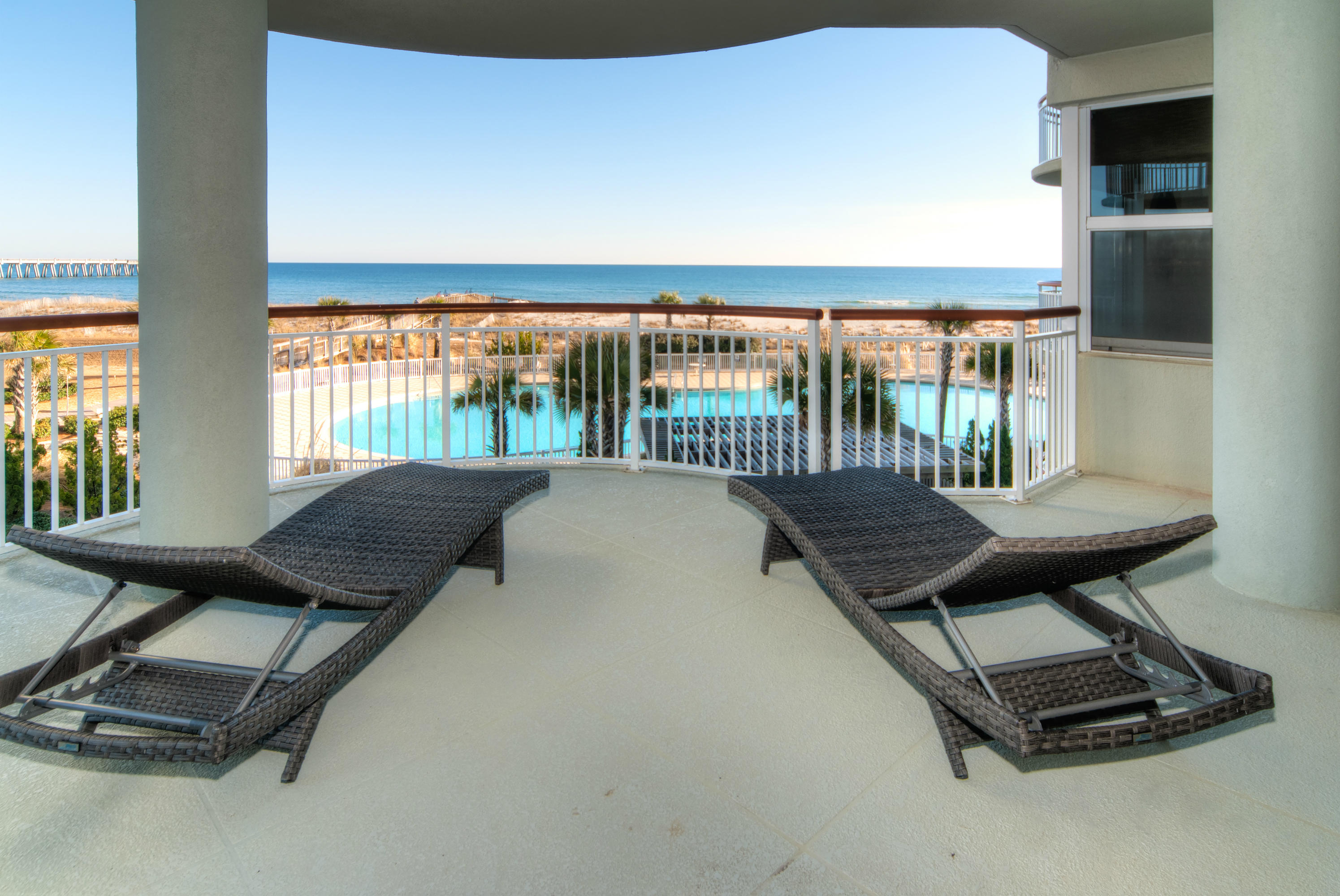 8501 Gulf Boulevard, Unit 1E Navarre, FL 32566 - Photo 8 of 12 a bed sitting in a bedroom next to a window