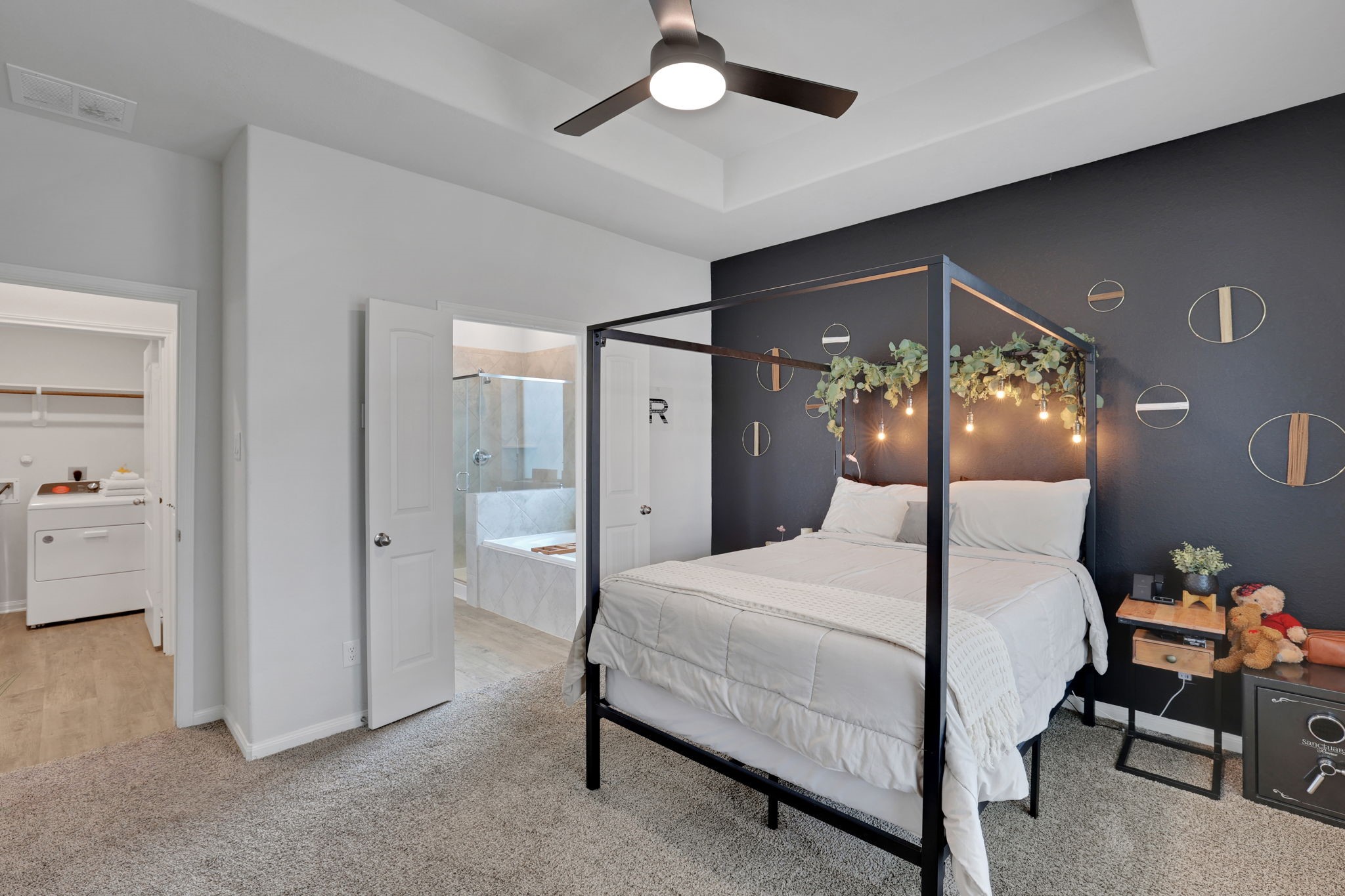 11208 Danny Lane Willis, TX 77318 - Photo 21 of 43 a bedroom with a bed and a large mirror
