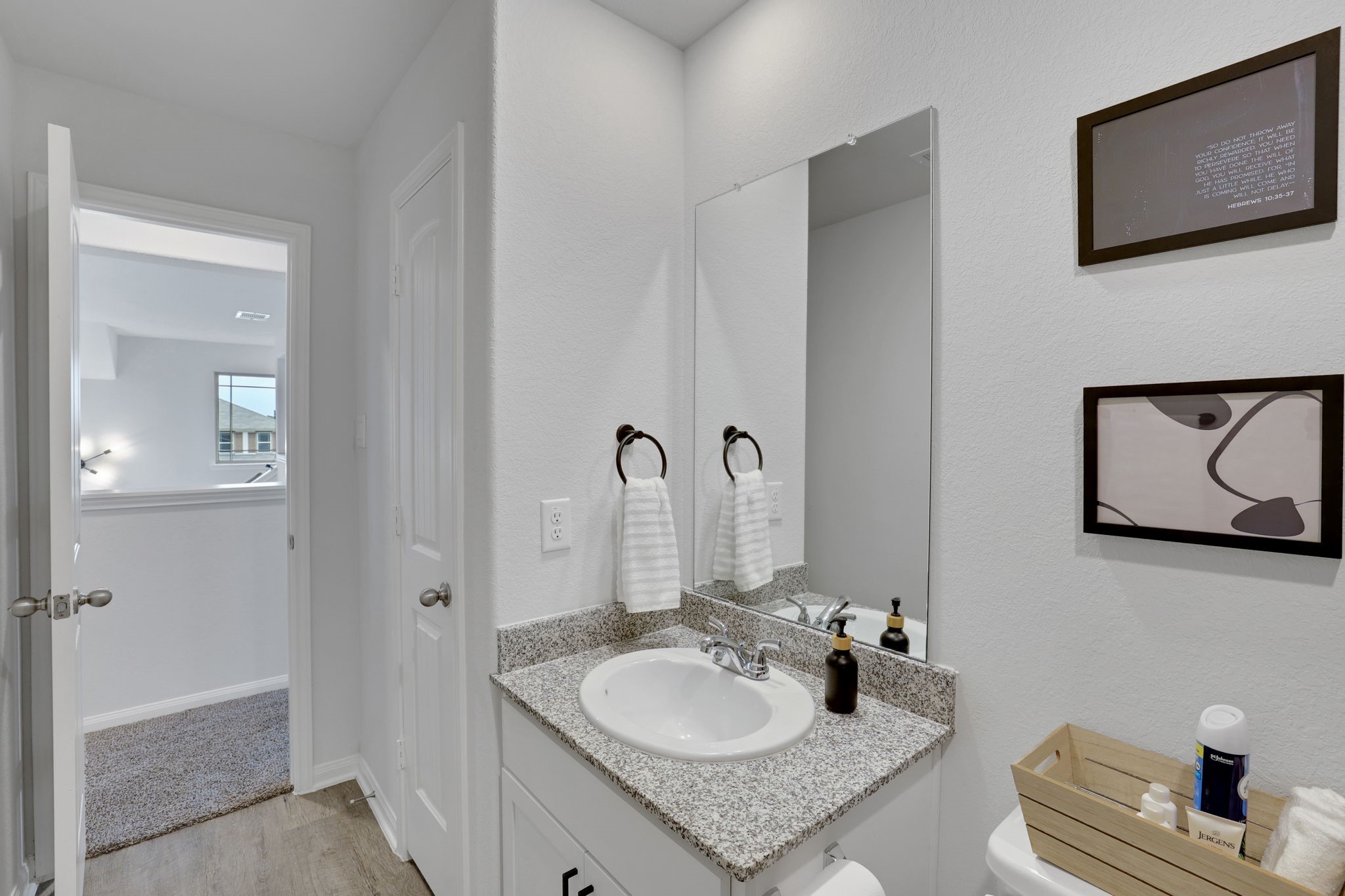 11208 Danny Lane Willis, TX 77318 - Photo 35 of 43 a bathroom with a granite countertop sink and a mirror
