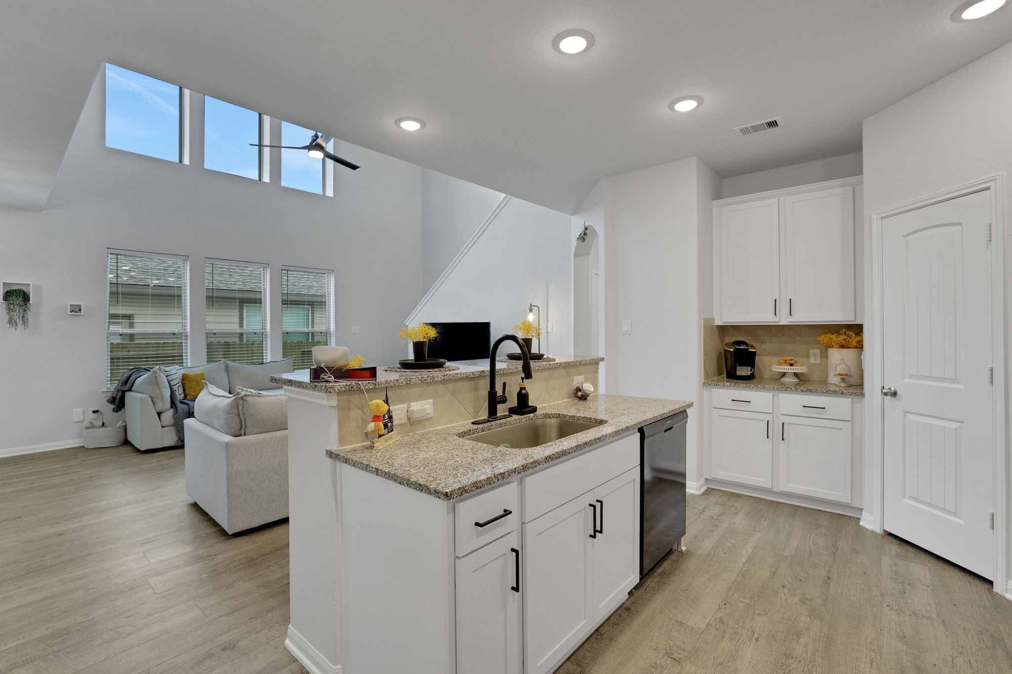 11208 Danny Lane Willis, TX 77318 - Photo 9 of 43 a kitchen with white cabinets and sink