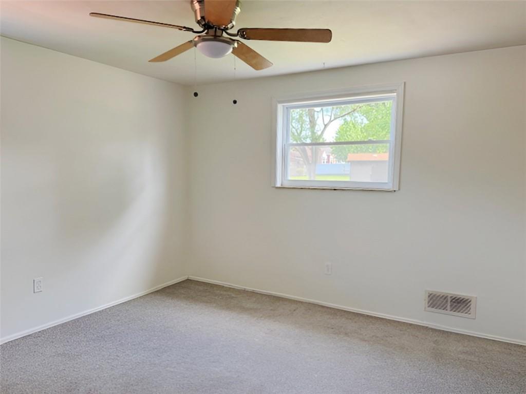 279 Olympic Road Pittsburgh, PA 15236 - Photo 12 of 25 an empty room with a window and a fan