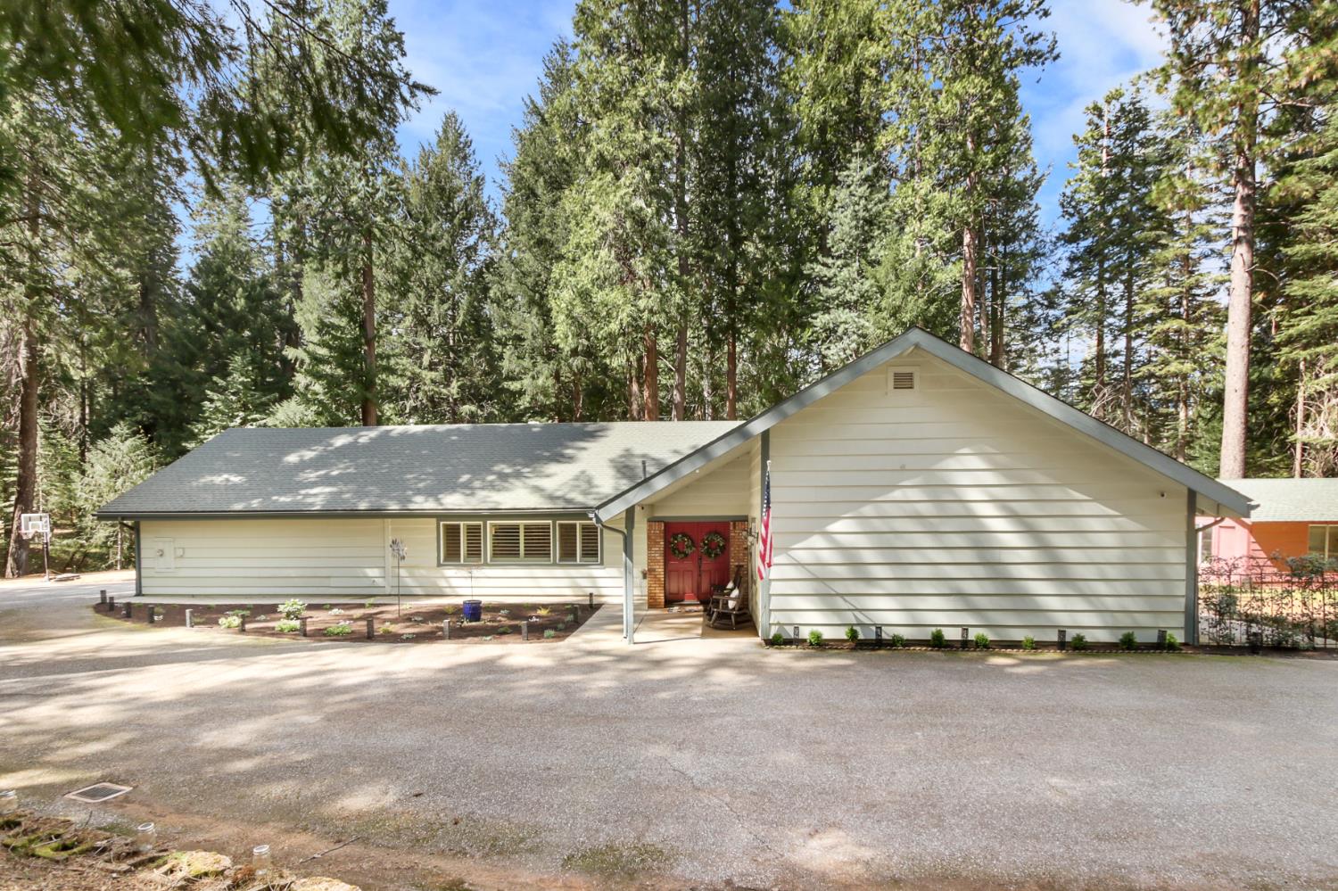 33837 Nary Red Road Alta, CA 95701 - Photo 11 of 74 a front view of a house with a yard and garage