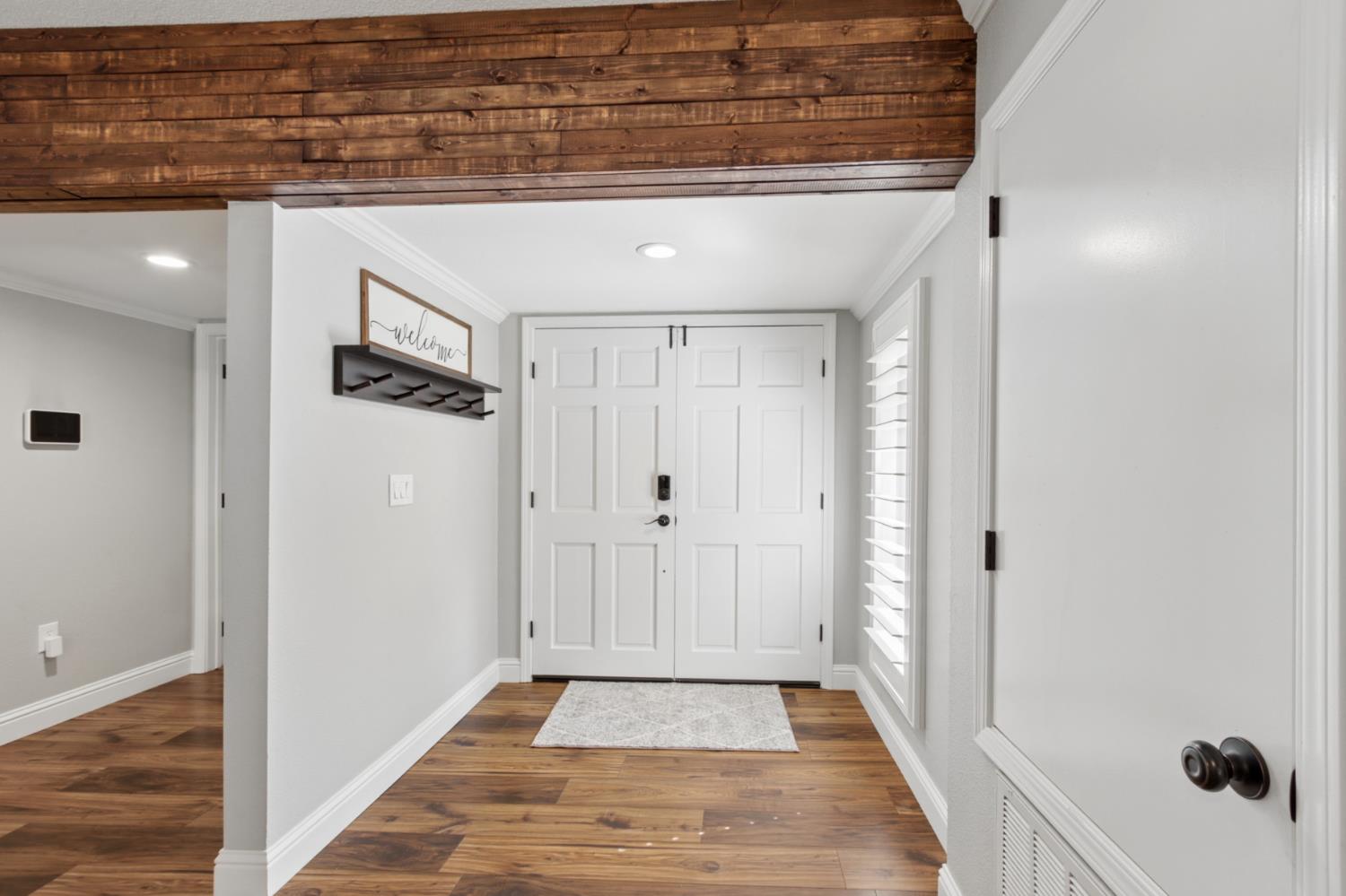 33837 Nary Red Road Alta, CA 95701 - Photo 15 of 74 a view of a hallway with wooden floor and staircase