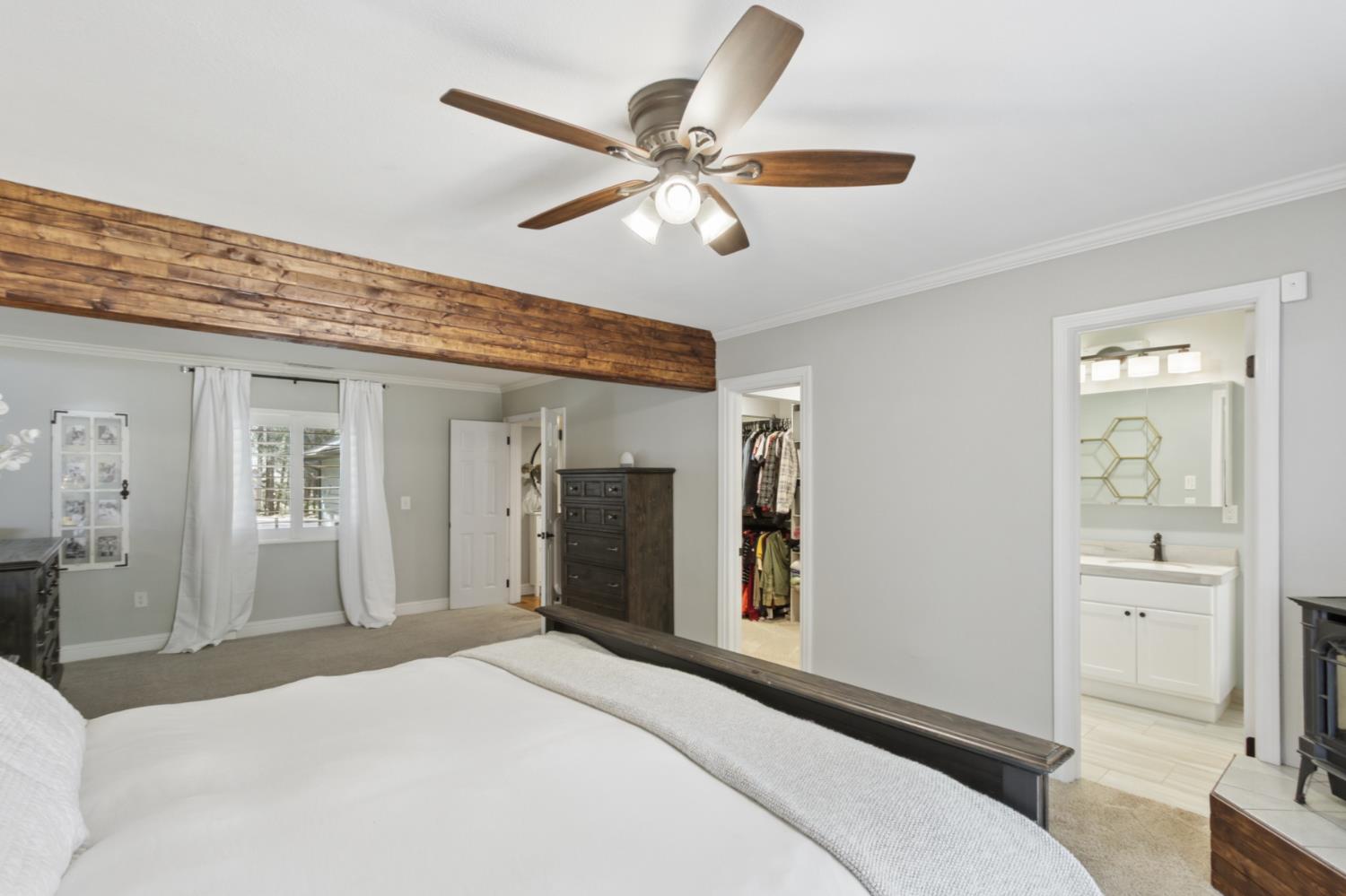 33837 Nary Red Road Alta, CA 95701 - Photo 44 of 74 a bedroom with a large bed and a chandelier