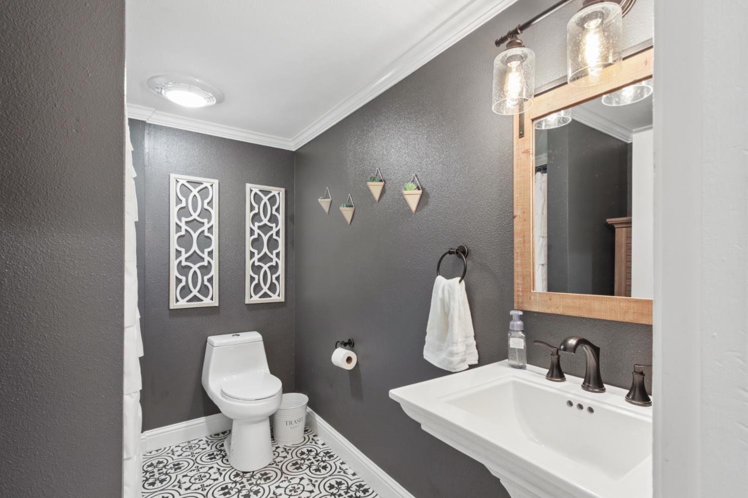 33837 Nary Red Road Alta, CA 95701 - Photo 51 of 74 a bathroom with a toilet sink and mirror
