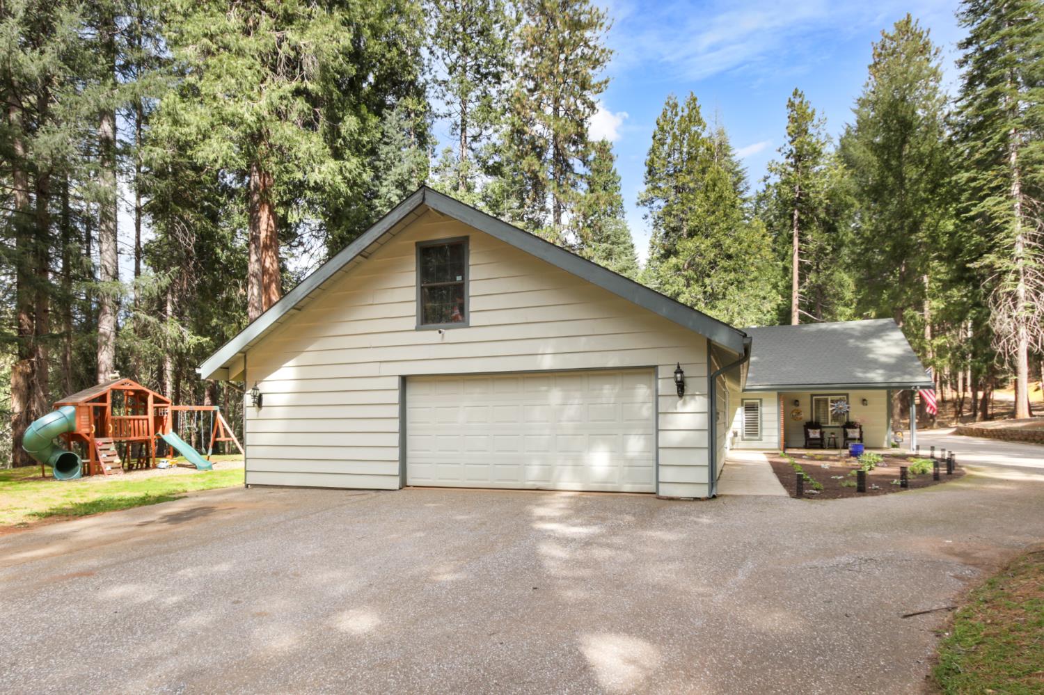 33837 Nary Red Road Alta, CA 95701 - Photo 68 of 74 a view of a white house with a large space and a road view