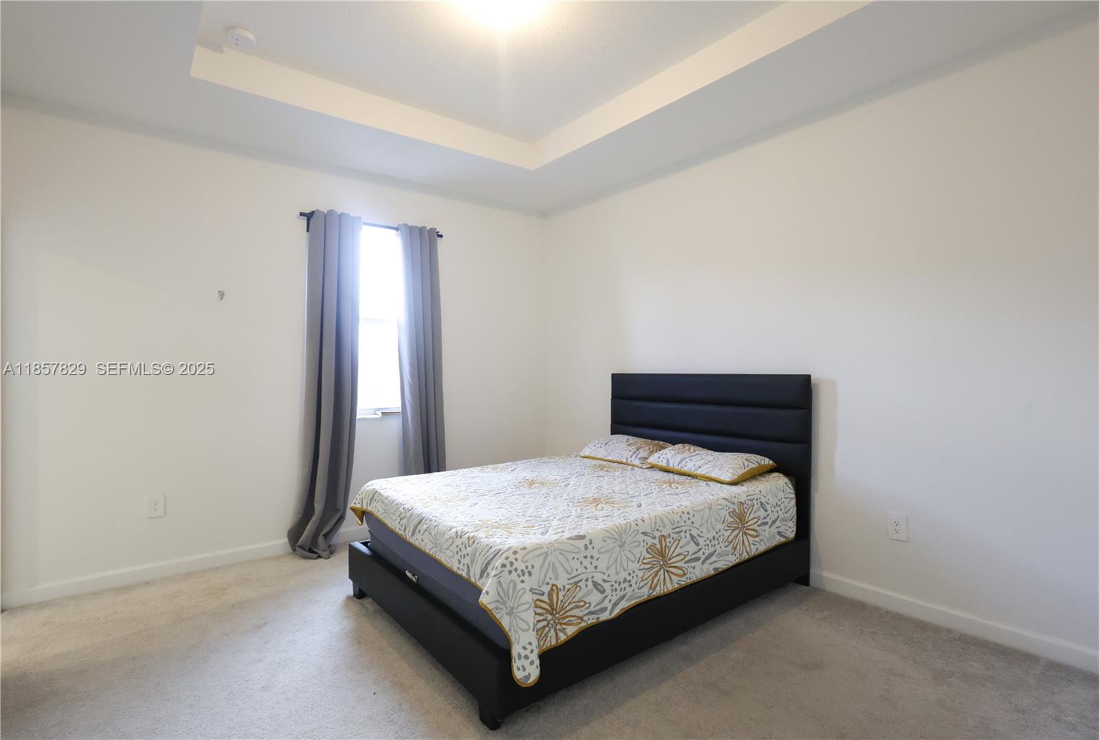 14824 Southwest 265th Street Homestead, FL 33032 - Photo 13 of 17 a bedroom with a bed and wooden floor