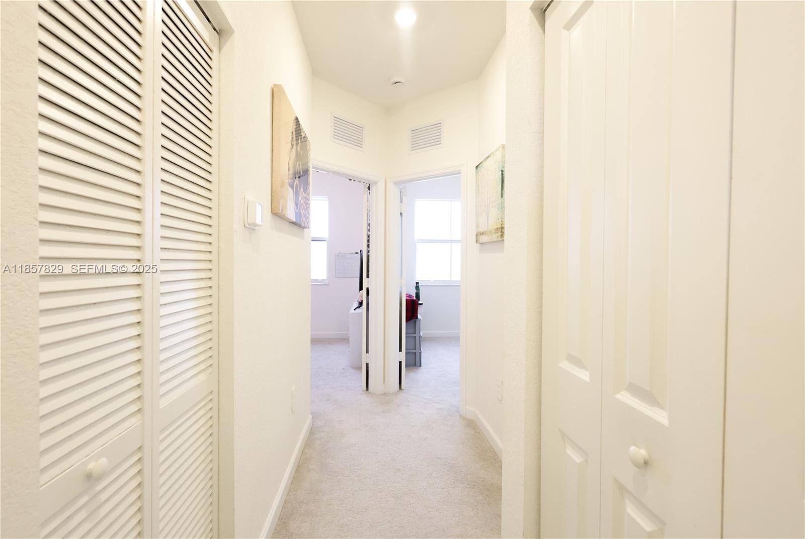 14824 Southwest 265th Street Homestead, FL 33032 - Photo 14 of 17 a view of a bathroom from a hallway
